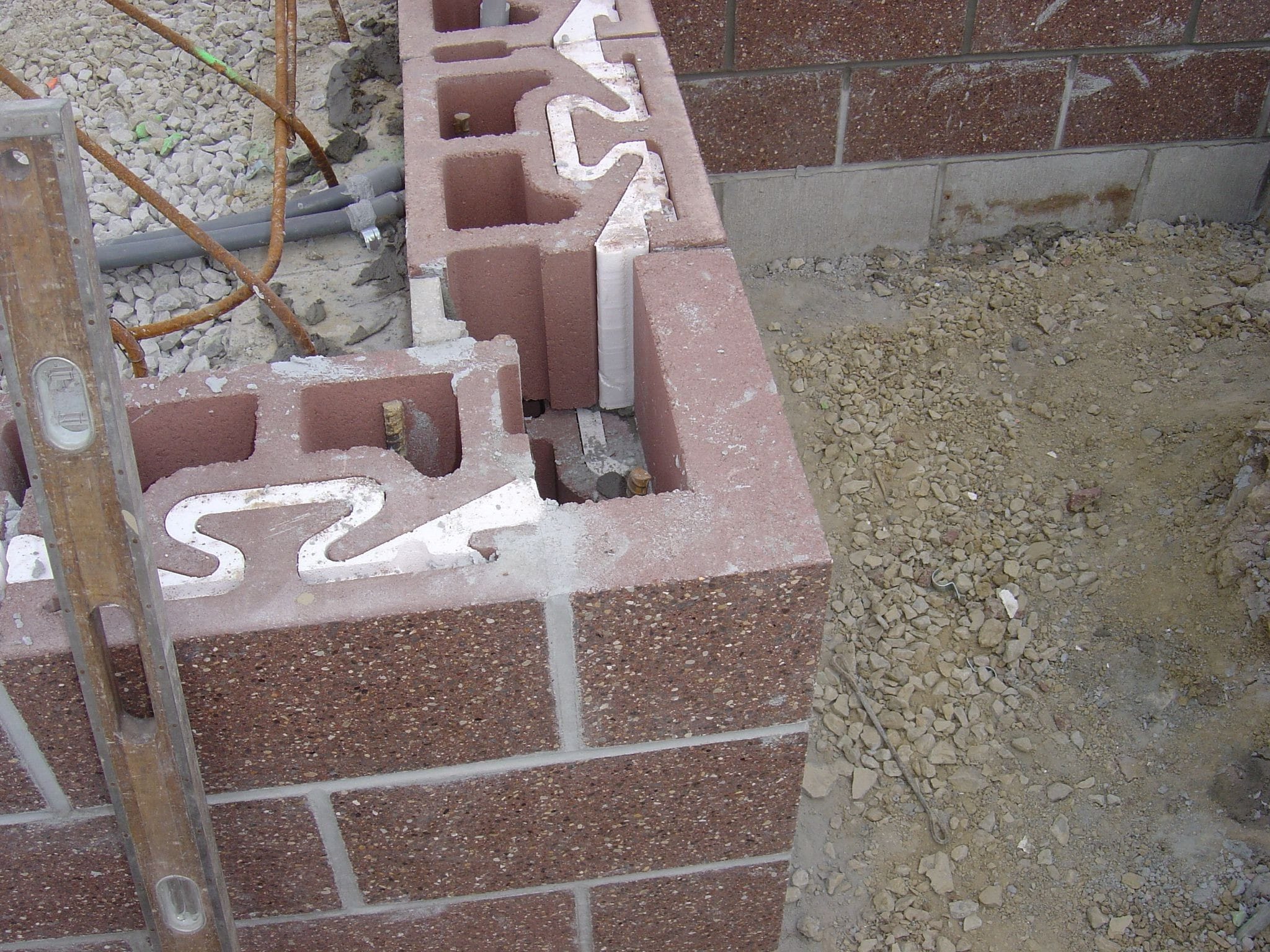 NRG 12 continuous insulation at corners using standard blocks and rigid EPS inserts.