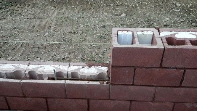 NRG insulated block at openings uses standard blocks and half blocks. Option 1.